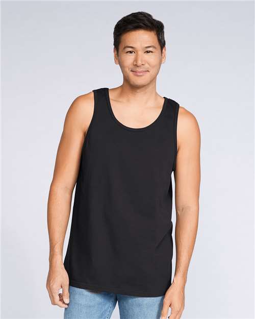Gildan 64200 Softstyle tank top in Black on a model, a ring-spun jersey tank blank for screen printing and DTG