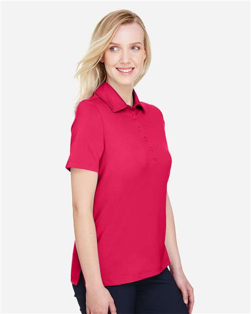 Women's CrownLux Performance® Range Flex Polo – On Model – Side