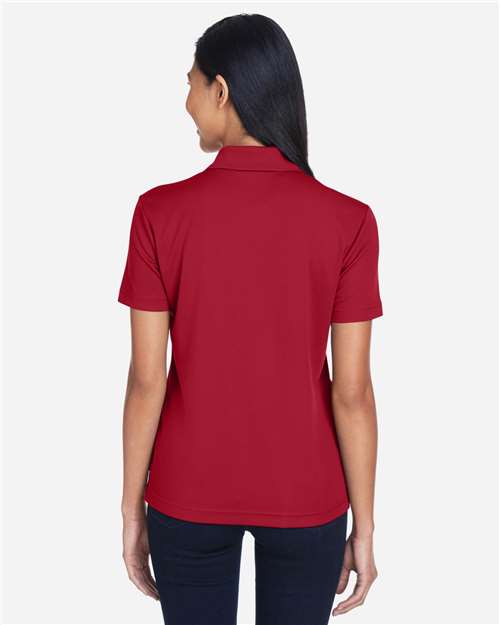 Women's Origin Performance Piqué Polo with Pocket – On Model – Back